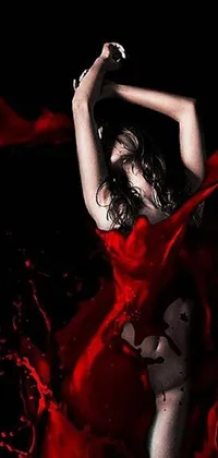 This live wallpaper for your phone features a bold poster art design of a woman in a striking red dress dancing sensuously against a black backdrop
