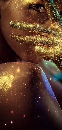 This phone live wallpaper showcases a stunning close-up of a face covered in glitter against a galactic shore backdrop