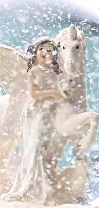 This live wallpaper displays a snow globe with a beautifully crafted statue of a woman and a horse