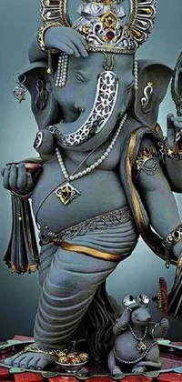 This phone live wallpaper showcases an ornate statue of an elephant in a striking standing pose