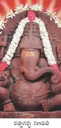 This live phone wallpaper showcases a stunning red sandstone elephant statue in intricate detail
