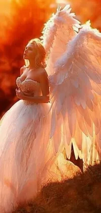 Get this stunningly beautiful live wallpaper for your phone! It features a woman in a white wedding dress with huge angel wings and a vibe that is definitely tumblr-worthy