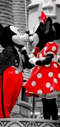 This black and white phone live wallpaper features the famous characters of Mickey and Minnie Mouse standing together
