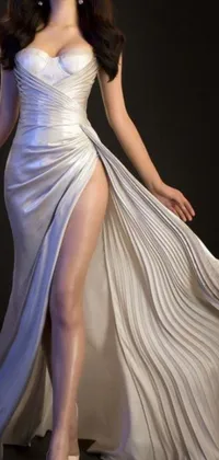 Experience the beauty and elegance of a timeless artwork with this phone live wallpaper depicting a woman in a flowing and intricate white dress