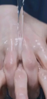 Looking for a lifelike <a href="/">live wallpaper for your phone</a>? Check out this hyperrealistic <a href="/cool-wallpapers/video-wallpapers">video wallpaper</a> that captures the act of handwashing with water from a faucet