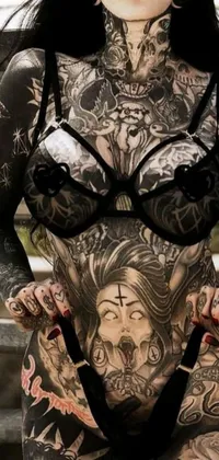 Looking for a stunning and edgy live wallpaper for your phone? Check out this scary and gothic-inspired design featuring a terrified woman with intricate tattoos and satanic imagery on her body