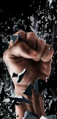 Experience a sense of power and danger with our live wallpaper featuring a menacing fist in close-up, against a shattered glass background