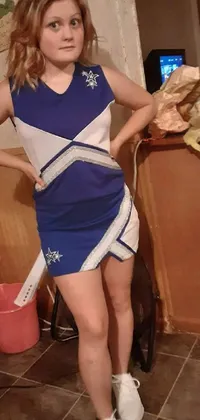 This phone live wallpaper showcases a female cheerleader posing for a picture in her blue outfit, adorned with a matching bow