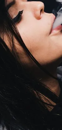 This live wallpaper depicts a close-up view of a girl smoking a cigarette
