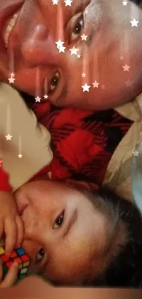 A heartwarming live wallpaper featuring a man lying next to a child on a cozy bed, with a picture in the background