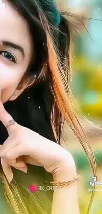 This phone live wallpaper showcases a captivating close-up shot of a youthful lady with a finger on her lips