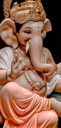 This phone live wallpaper showcases a close-up shot of an intricately designed elephant statue