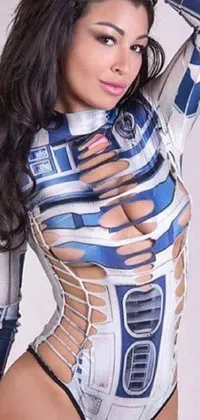 This live wallpaper features a sci-fi inspired design with a playful woman in a Star Wars costume, posing for a picture alongside R2D2