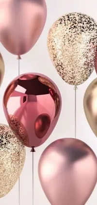 This phone live wallpaper features a whimsical design with pink and gold balloons caught in mid-air