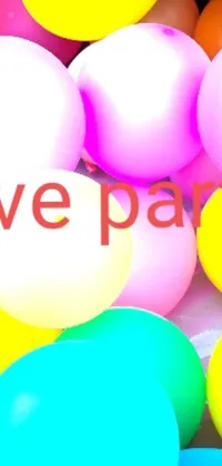 This live wallpaper shows a joyful scene with colourful balloons that read "love parties"