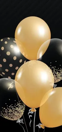 This black and gold balloon live wallpaper features elegant confetti and digital artwork