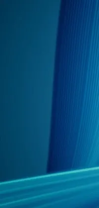 This live wallpaper features a stylish computer monitor on a modern desk, with an abstract blue design by digital artist Jan Rustem