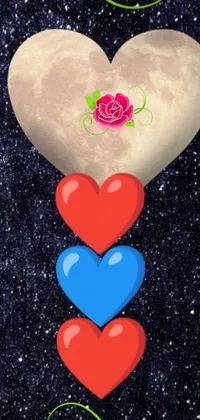 This mobile live wallpaper showcases a romantic motif with two hearts resting one on top of the other, entailing a Sailor Moon artistic vibe