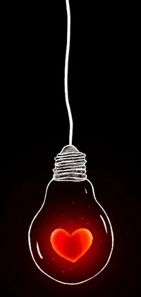 Enhance your iPhone's aesthetic appeal with this stunning live wallpaper featuring a light bulb with a heart inside