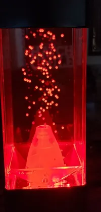 This phone live wallpaper features a mesmerizing lava lamp, hologram, and kinetic pointillism