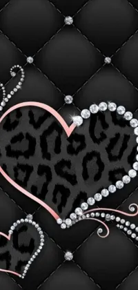 This phone live wallpaper displays a leopard print heart surrounded by a black quilt-like design with diamonds