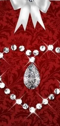 This phone live wallpaper is a luxurious masterpiece, featuring a heart-shaped diamond necklace on a red background