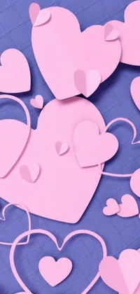 This live wallpaper boasts an eye-catching image of pink paper hearts scattered across a calming blue background for a soothing and affectionate atmosphere