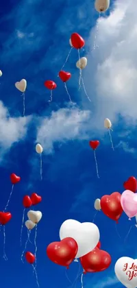 This phone live wallpaper features a delightful scene with red and white balloons, adding a touch of romance to your device's background