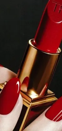 This stunning phone live wallpaper features a close-up of a hand holding a red lipstick against a liquid gold background