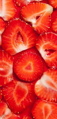 This phone live wallpaper showcases a stunning image of sliced strawberries piled on top of each other