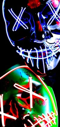 This phone live wallpaper features neon masks with a voodoo twist