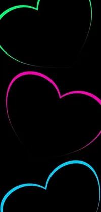 This live wallpaper for phones features three neon hearts against a black backdrop