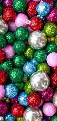 This stunning phone live wallpaper features a close up of a pile of Christmas balls, boasting granular detail and random metallic colors