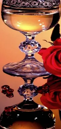 This stunning live wallpaper features a romantic composition with two wine glasses and a rose on a mirrored table