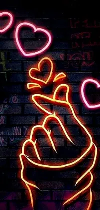 This live wallpaper will add visual interest to your phone with a striking neon sign in the shape of a hand holding a heart
