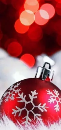 Get in the Christmas mood with this amazing red ornament live wallpaper for your iPhone 15