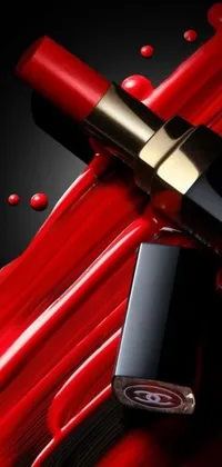This live wallpaper features a close-up shot of a lipstick on a red background