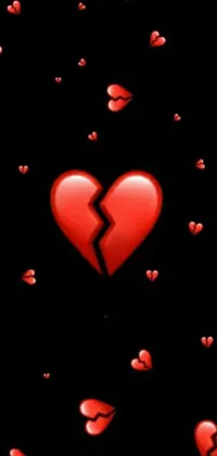 This phone live wallpaper features a striking close-up of a broken heart set against a black background