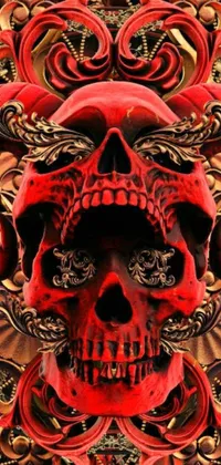 This live wallpaper features a red skull set against a black background with ornate golden details and ram skulls