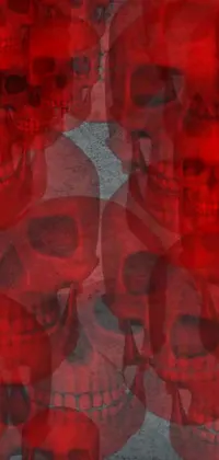 Get ready to add a spooky touch to your phone screen with this stunning live wallpaper! Created by a talented digital artist, this design features a group of skulls sitting together on a red fabric background