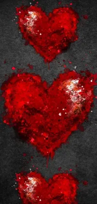 This digital phone live wallpaper features a beautiful depiction of two red hearts on a table in a Jim Dine-inspired style