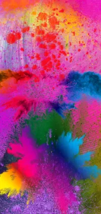 This live wallpaper showcases a stunning display of colorful powder floating through the air in a spectacular dance of hues