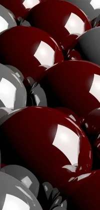 This captivating phone live wallpaper showcases a plethora of striking red and white balloons set against a bold black and brown backdrop