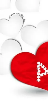 This phone live wallpaper features a dynamic red heart surrounded by white hearts on a black background