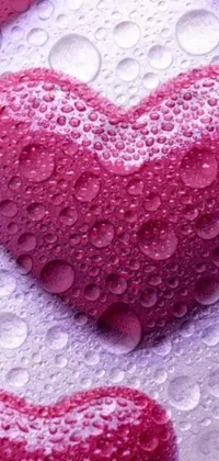 Experience true love at first sight with this stunning phone live wallpaper featuring a group of red hearts covered in water droplets