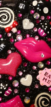 This dark live wallpaper showcases a close-up of a cell phone on a table, overlayed with a bold red lipstick kiss and decorated with stylish shoes and dresses
