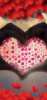 Add a touch of romance to your phone with this live wallpaper featuring a digital rendering of a heart-shaped hand gesture