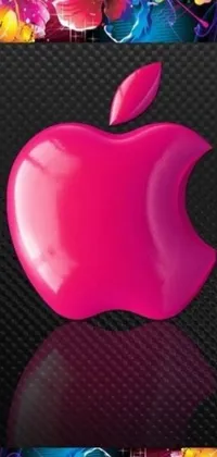 This stunning phone live wallpaper features a vibrant pink apple on a glossy black surface