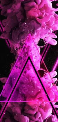 This phone live wallpaper features mesmerizing pink smoke in a triangle shape on a black background