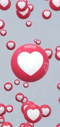 This phone live wallpaper features a charming display of red and white hearts that gently float across the screen, paired with floating spheres and shapes to create a playful and layered effect
